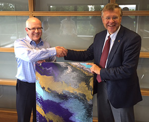 HMG Paints John Falder presenting painting to Doodsons Neil Clayton