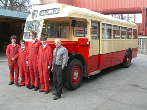 John and some students who worked on the Crossley Bus Restoration, with support from HMG Paints.